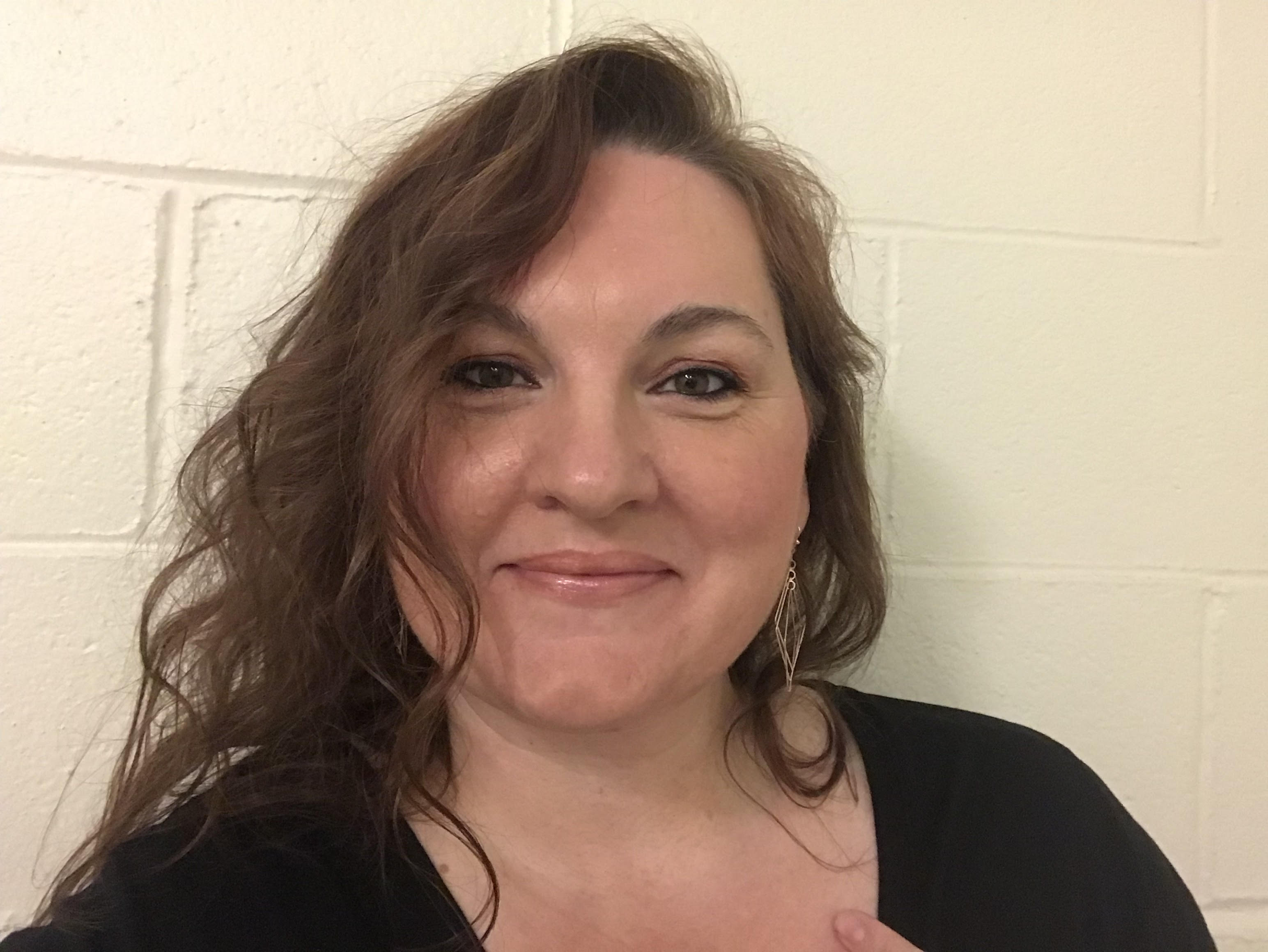 Headshot of Jen Hughes, smiling.