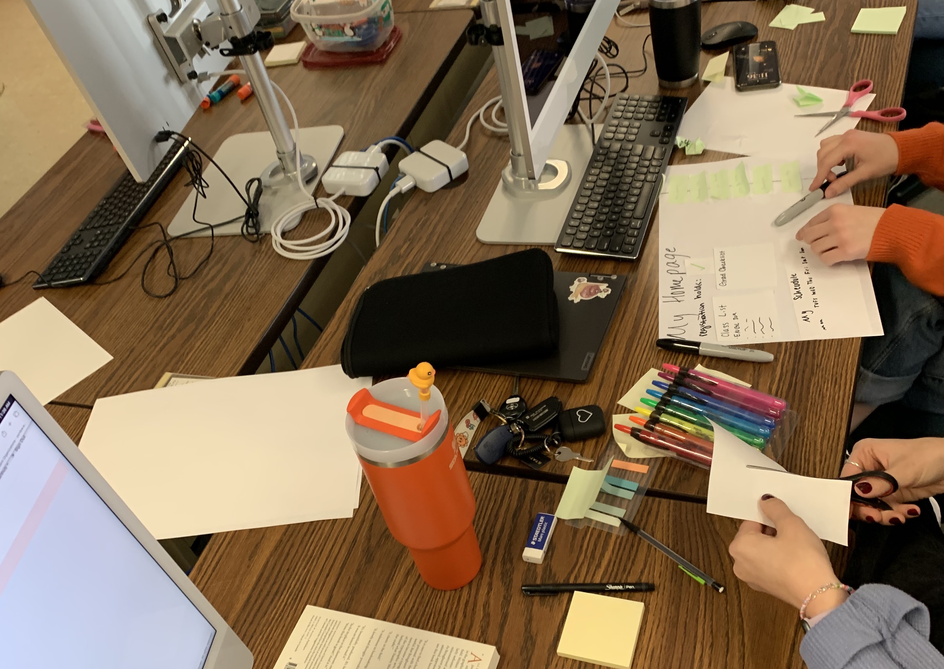 Students working with physical and digital media. 