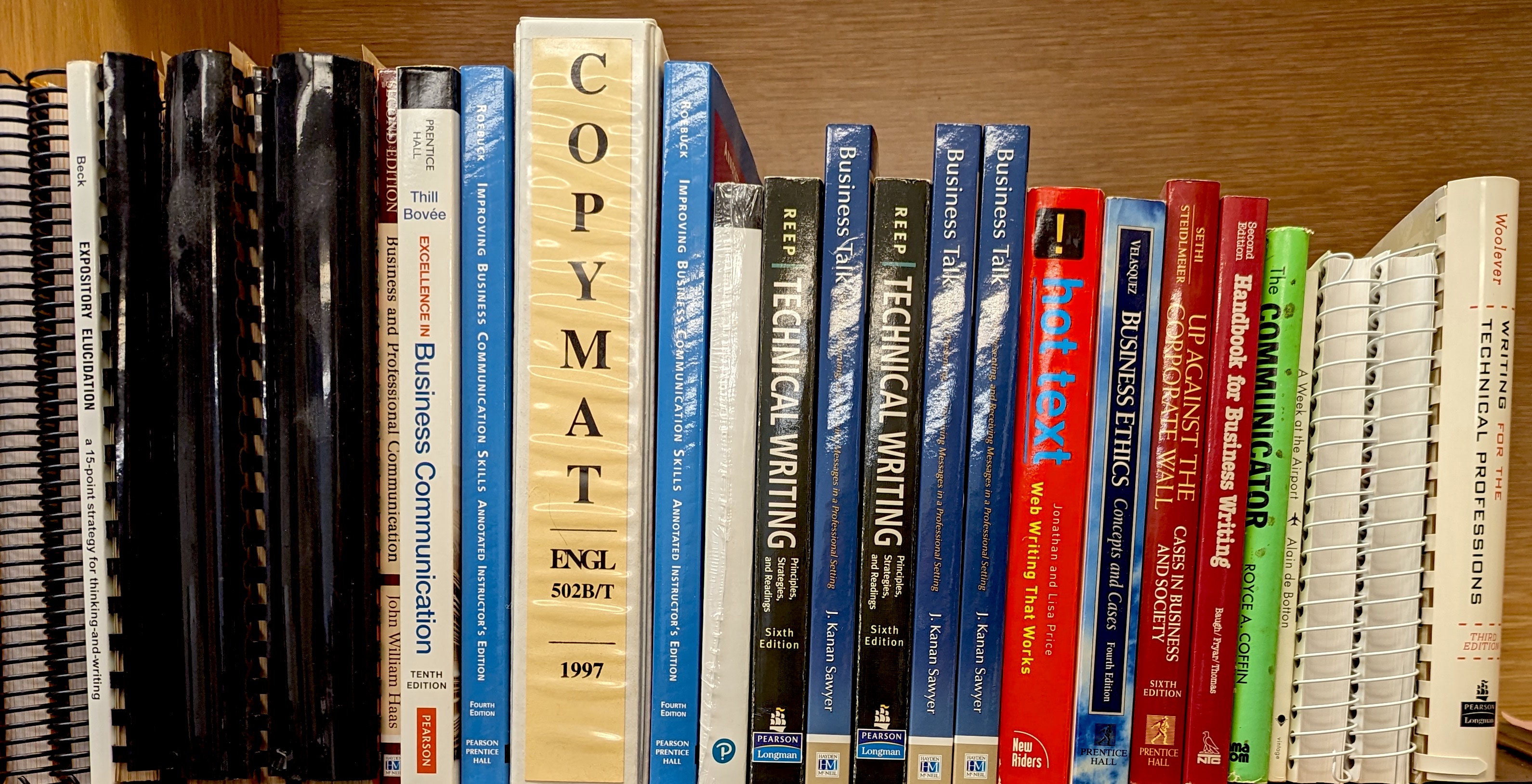 Bookshelf of technical writing books.