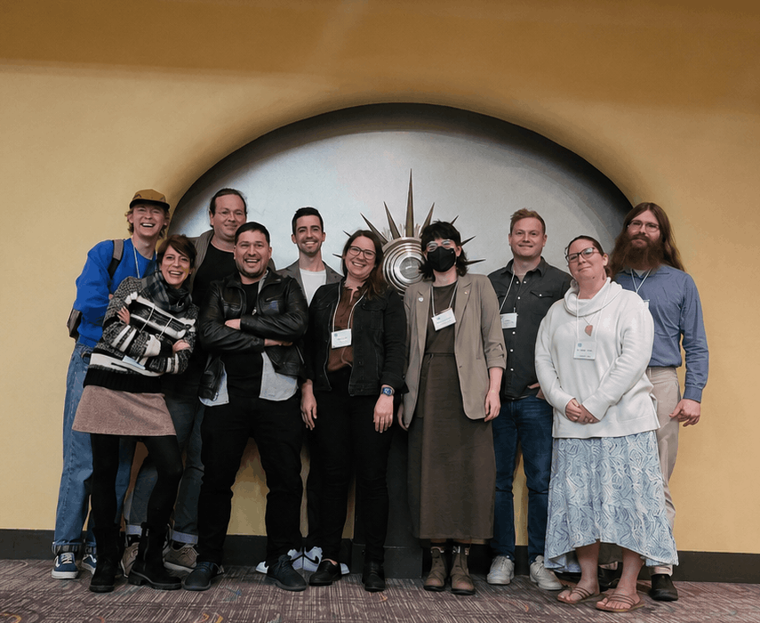 A group photo of some of our faculty and students in a conference