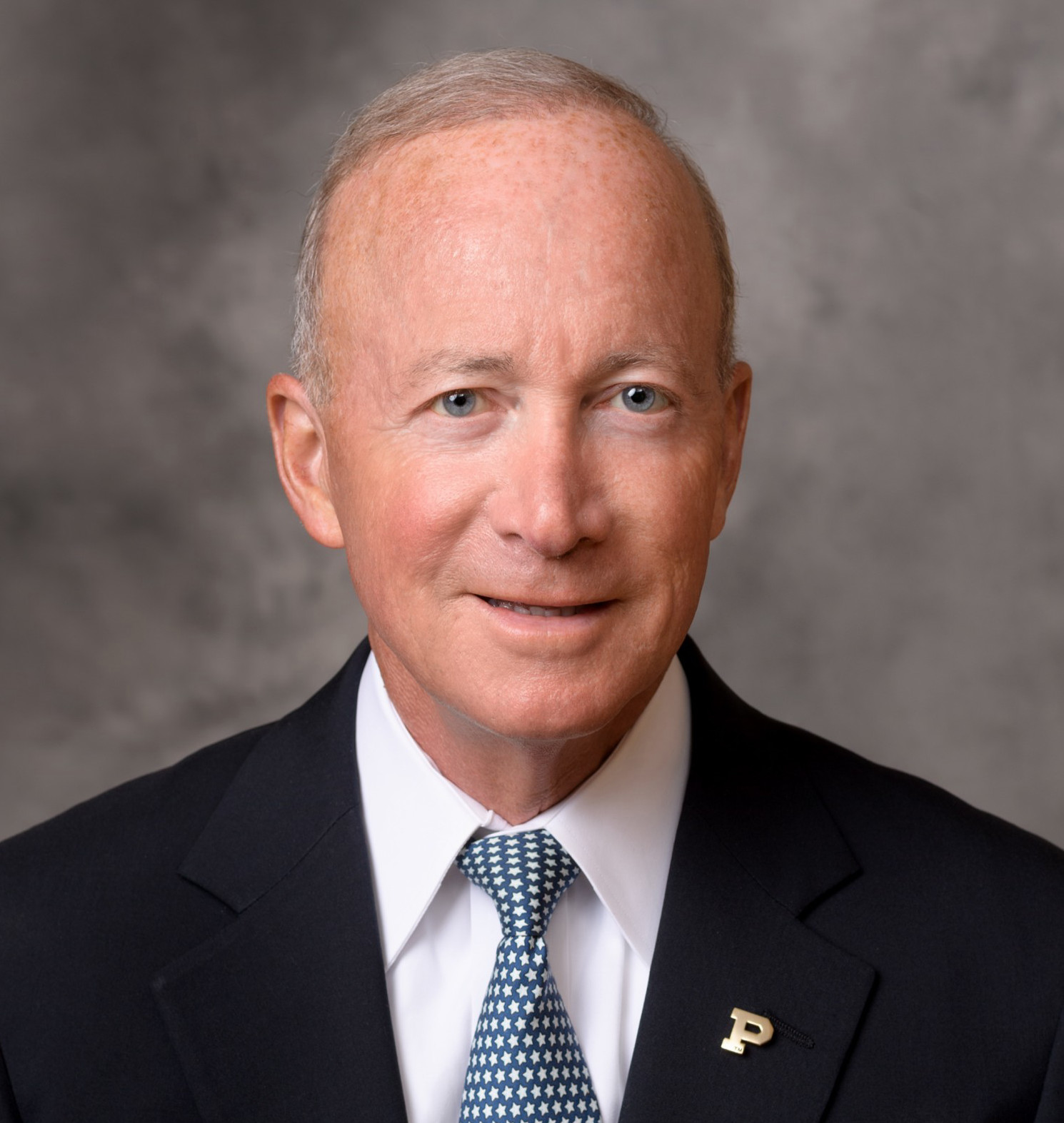 A headshot of Mitch Daniels Jr