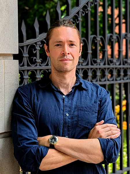 A headshot of Eamon Duede