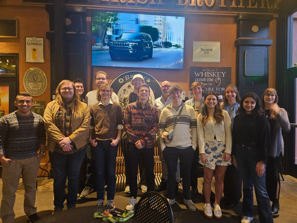 Thirteen Undergraduate scholarship grantees facing the camera