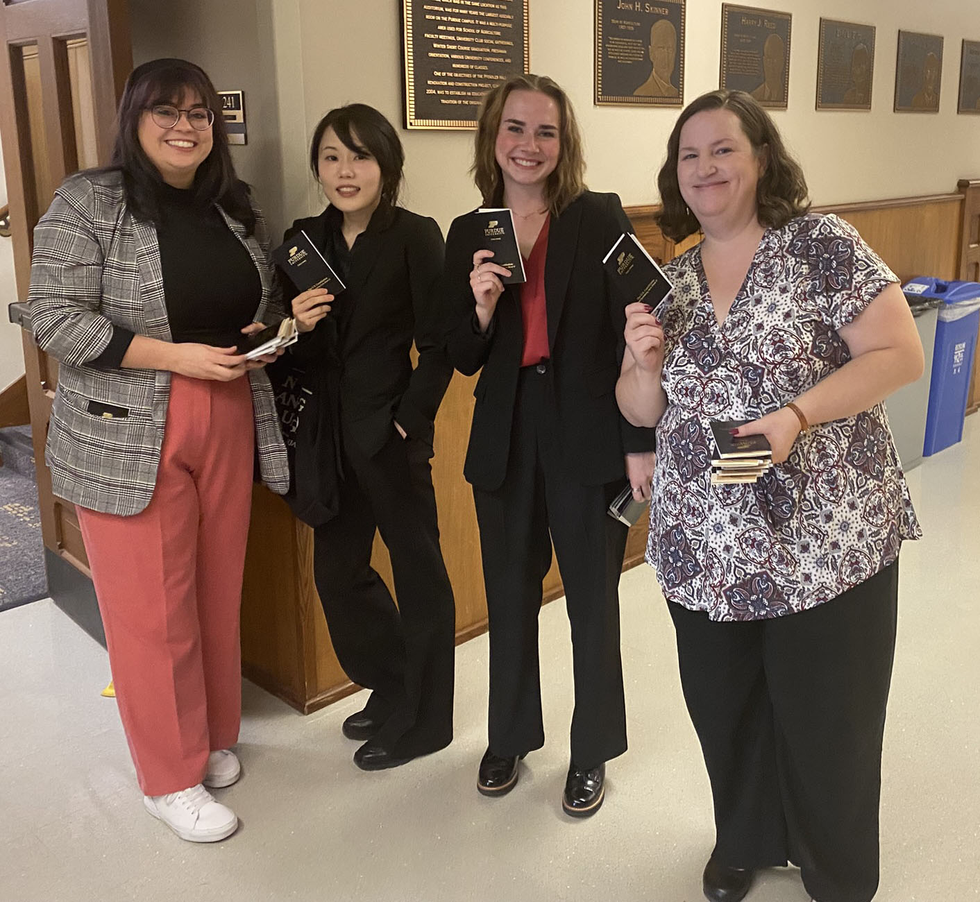 Group of students giving out pocket constitutions