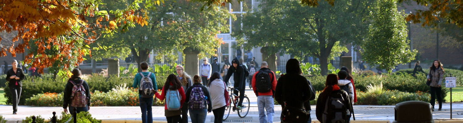Group of students walking across campus