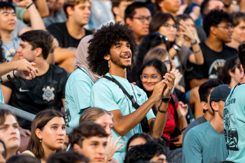 Crowd of students clapping