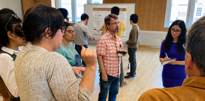 Graduate students presenting research