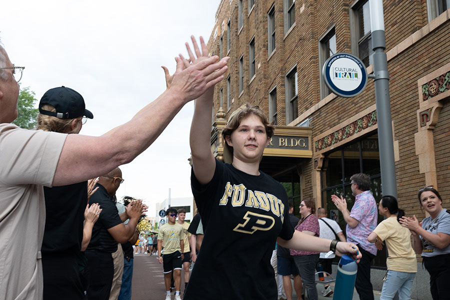 Student in a race being high-fived