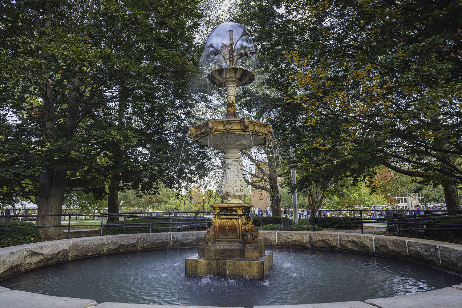 Beautiful fountain with rainbow reflections