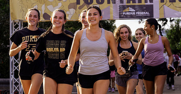 Group of undergraduate students competing in a race