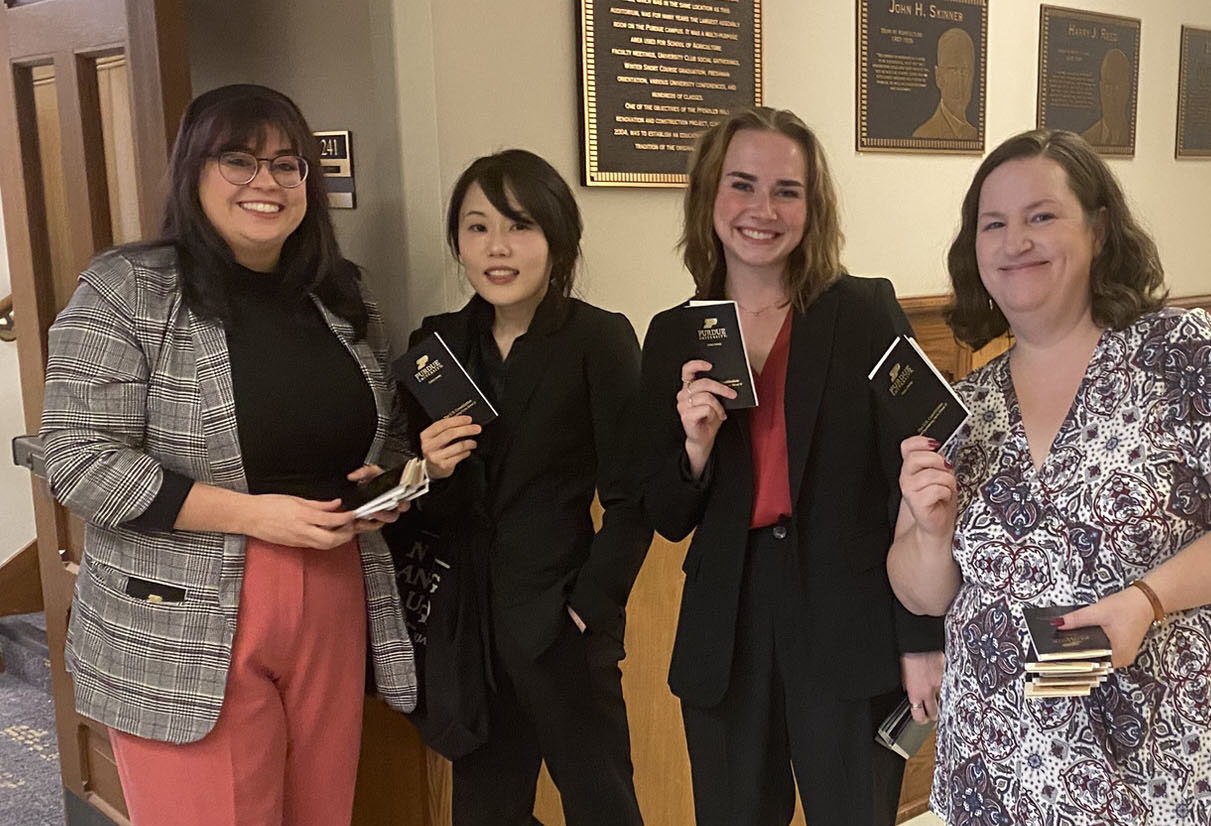 Group of students hand out pocket Constitutions