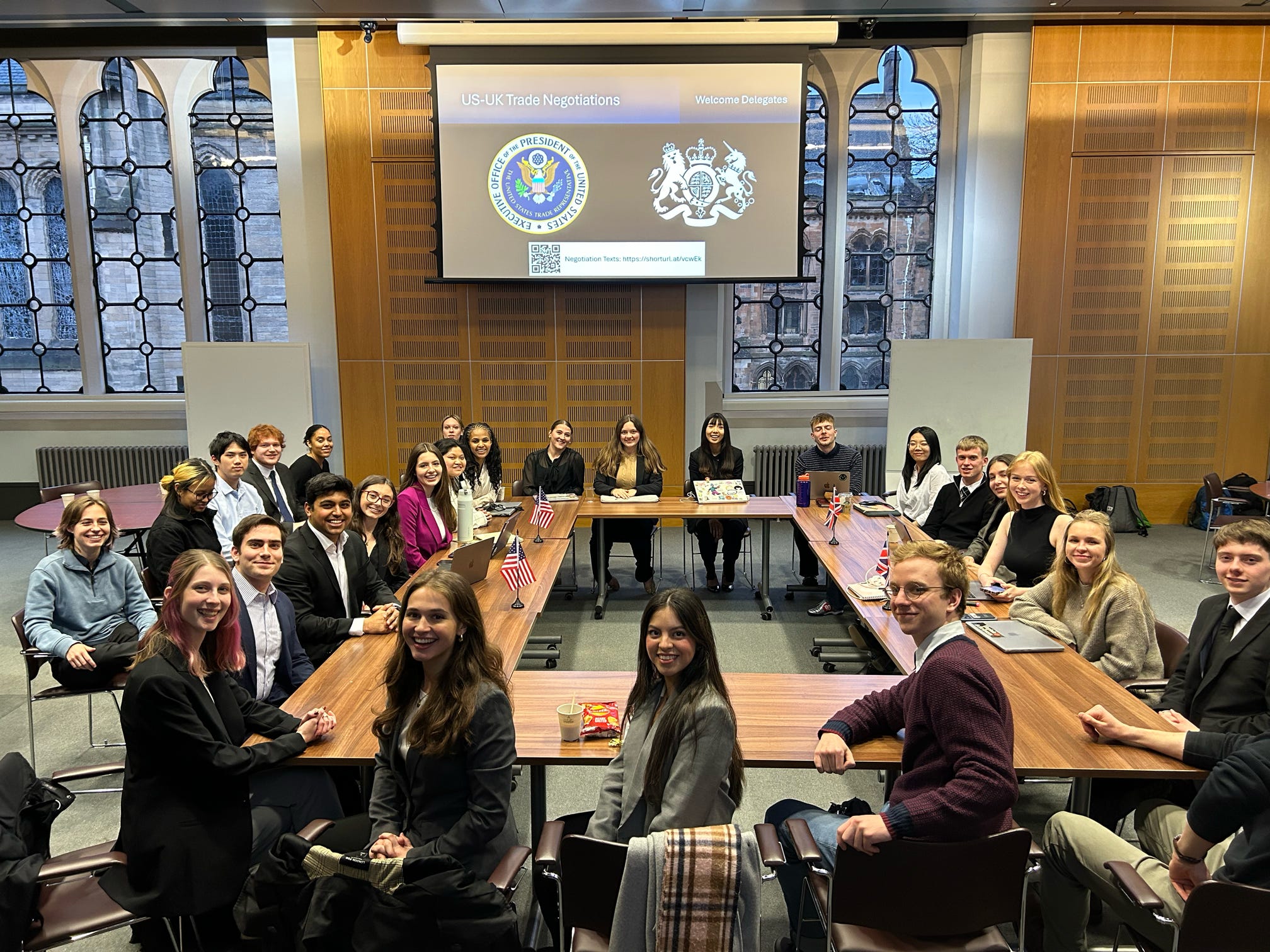 Students participating in a negotiation simulation