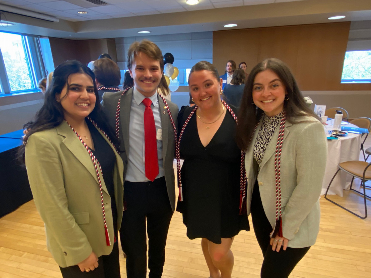 Four students receiving honors at the undergraduate awards banquet.