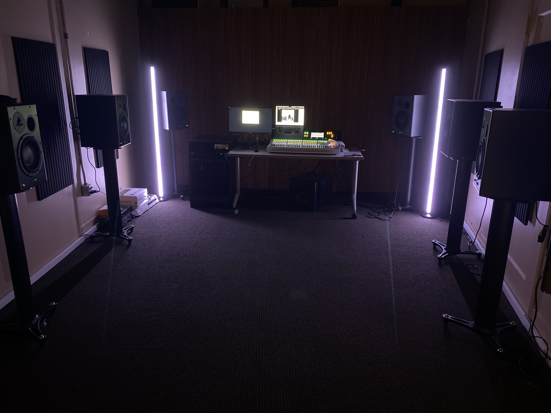 Music Production Studio in Elliott Hall with production equipment, speakers, and LED lighting.