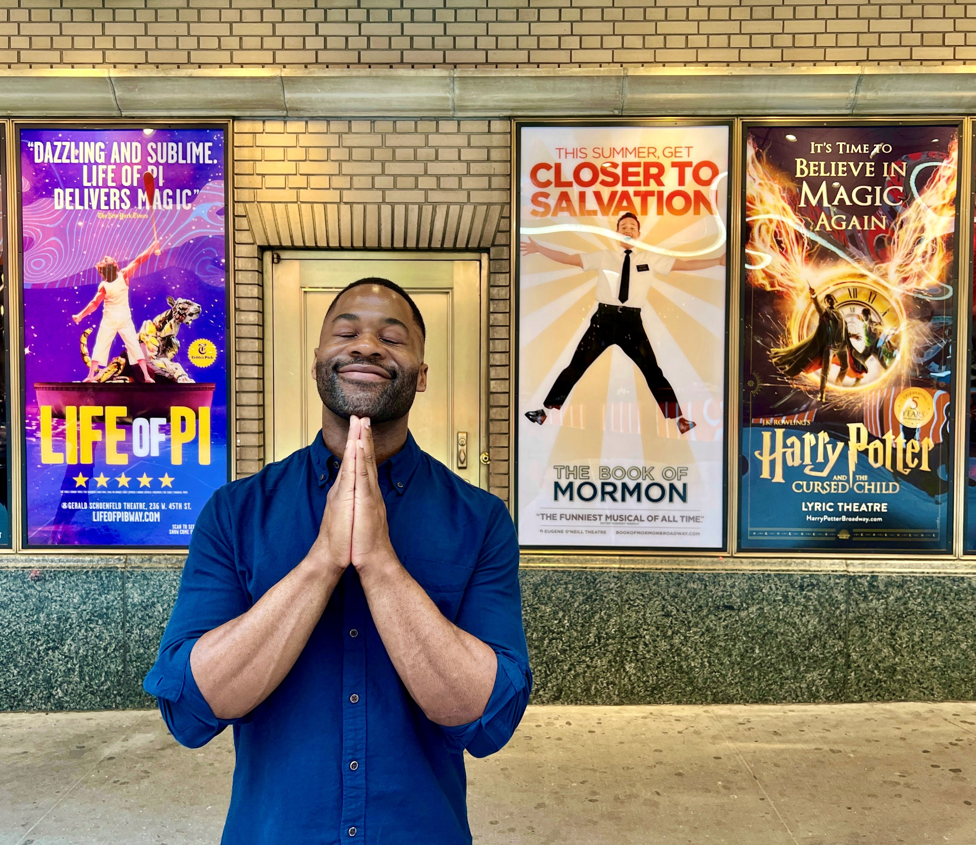 Oge Agulué in Shubert ally flankeby a few of his past Broadway credits.