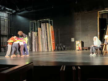 Ann Cooper Albright on stage with students