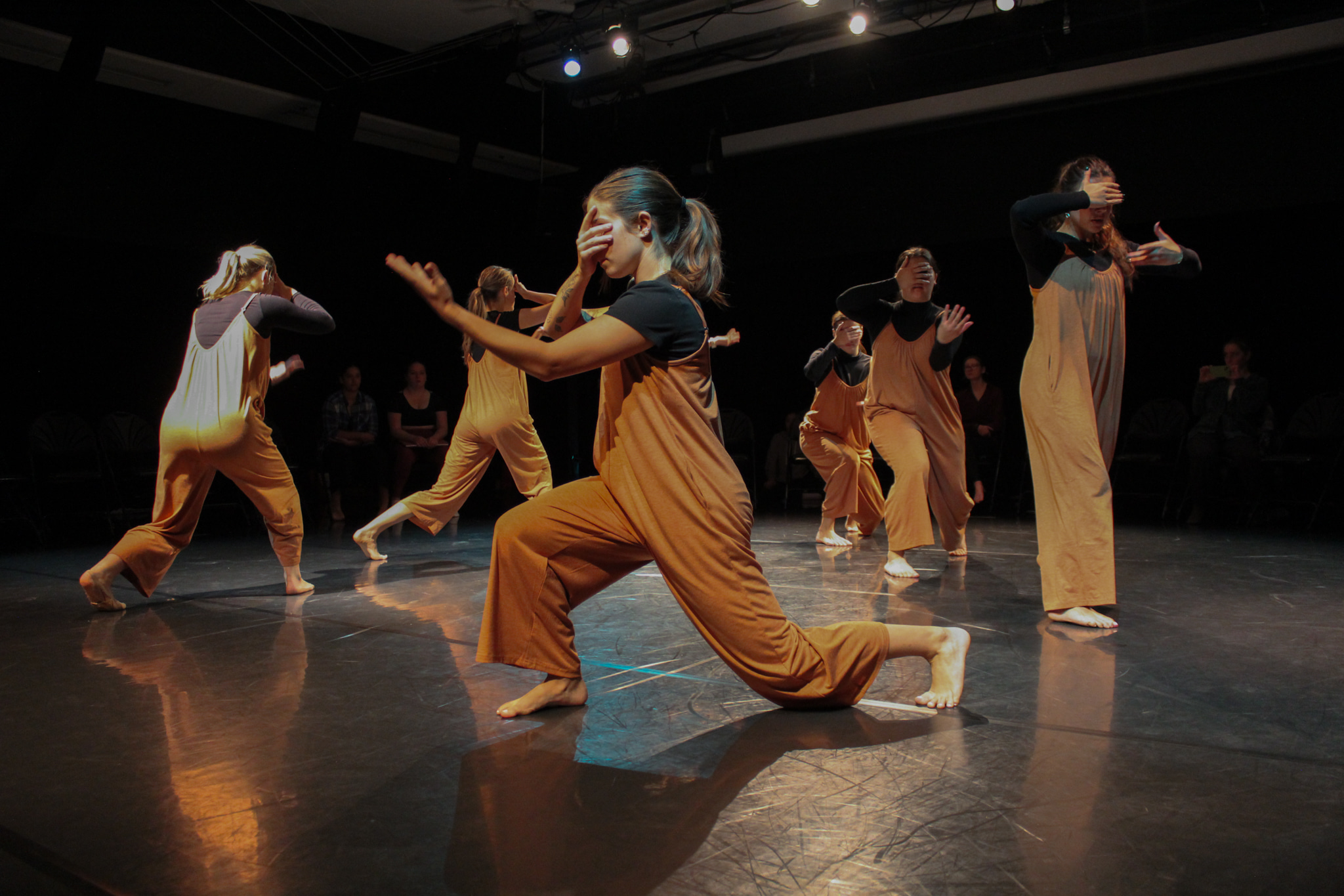 Five dancers on stage.