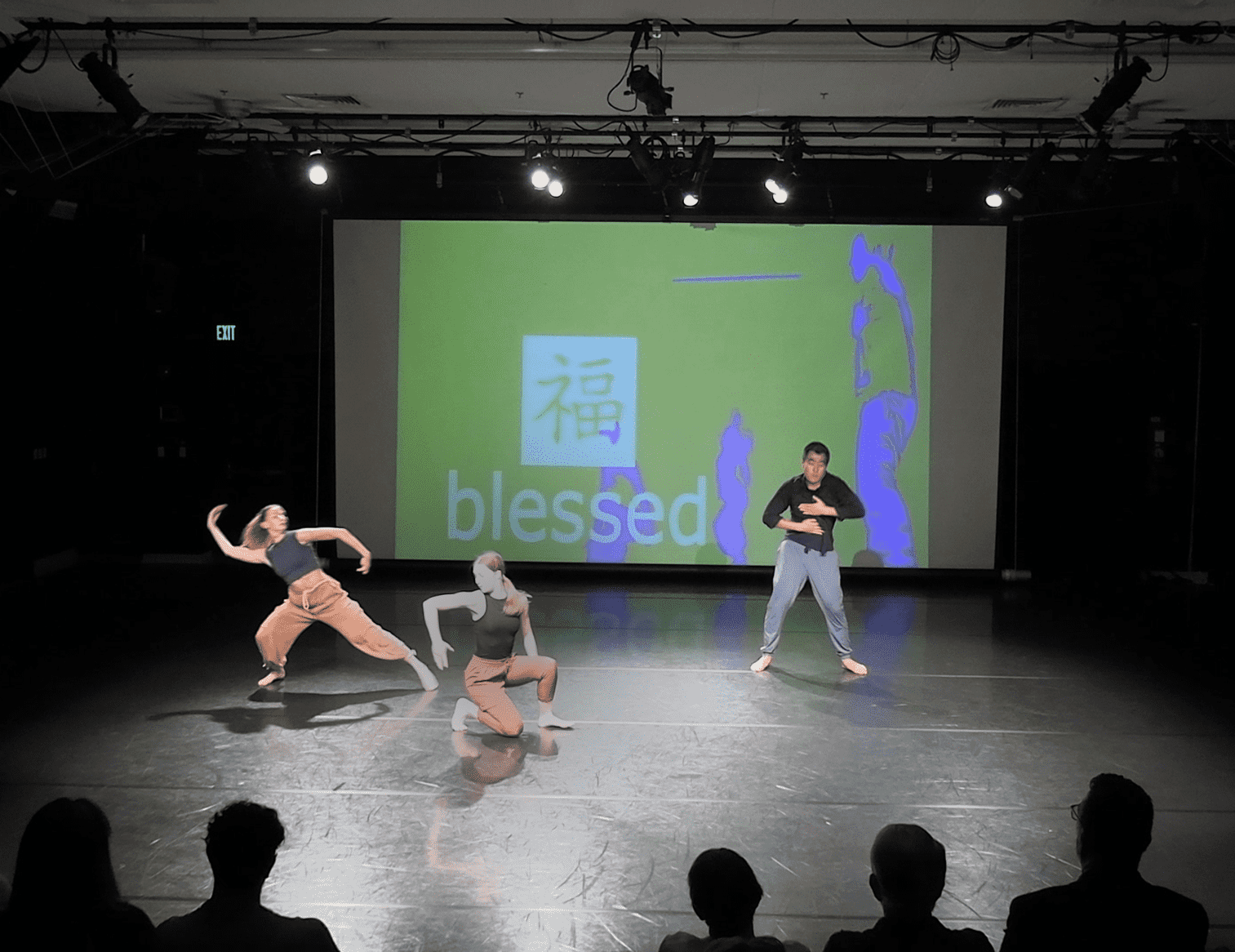 Dancers on Stage with Projection in the background