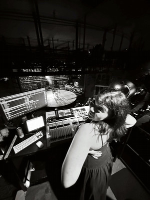 Maddie O'Neal sitting in a sound studio surrounded by sound equipment