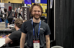 Trevor Marshall standing in front of a control board