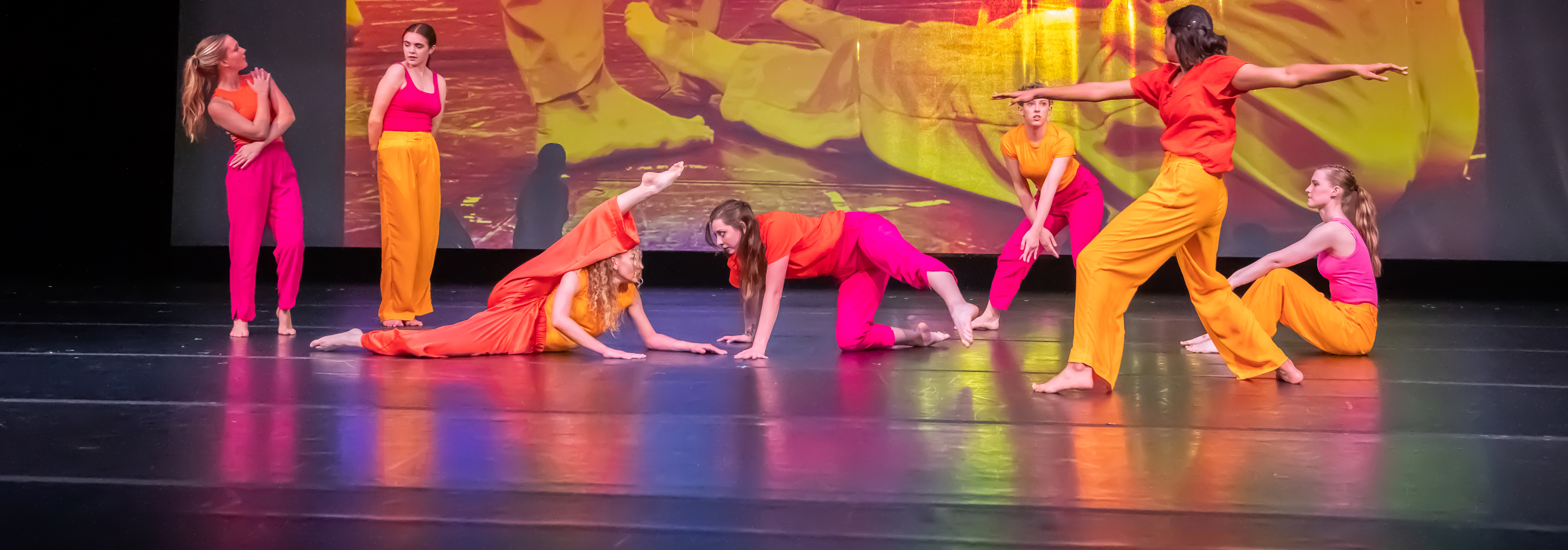Dancers posing on stage.