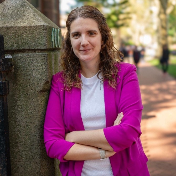 Silvia Perez head shot leaning on post