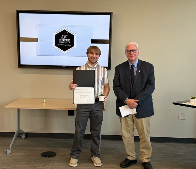 Drake and Thomas standing together at award ceremony