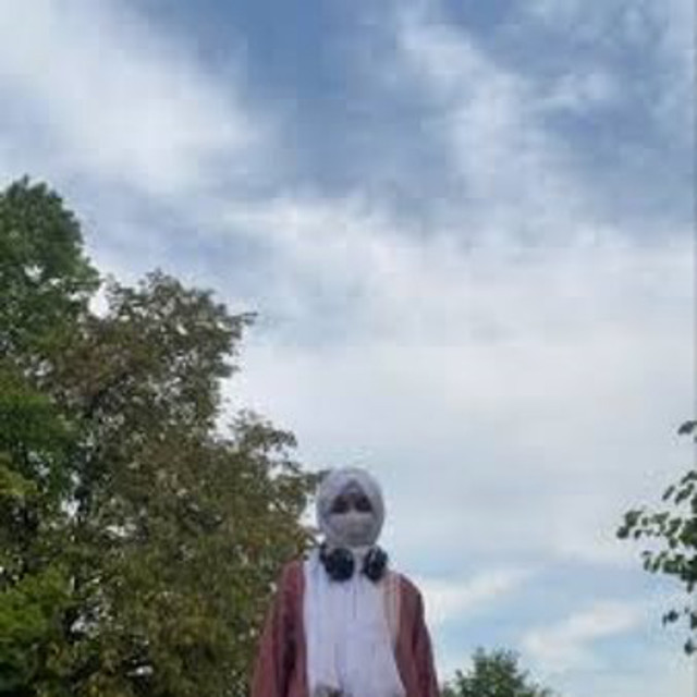 Rida altaf standing with sky background
