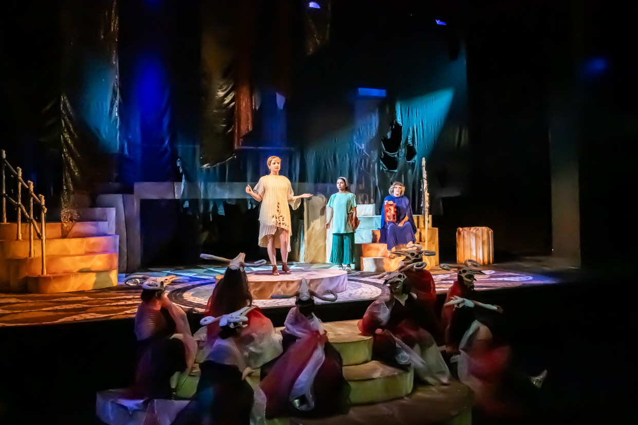Theatre stage with actors performing a scene from Galinthias.