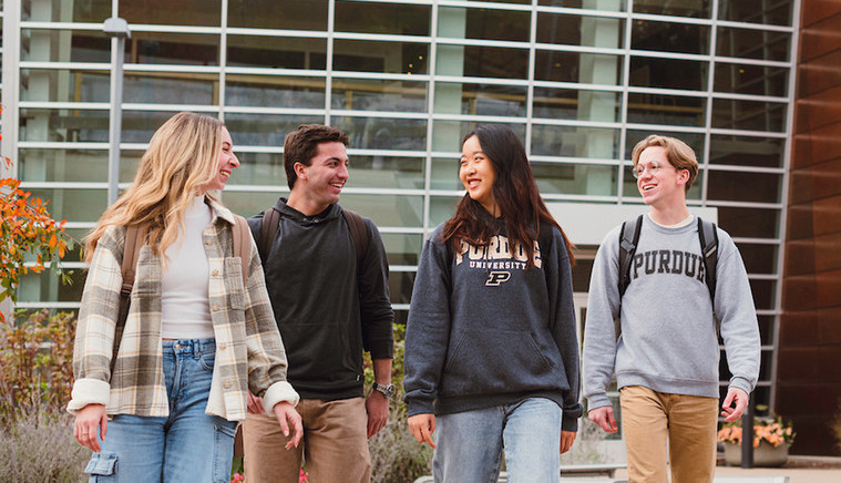 Students walking outside near a campus building